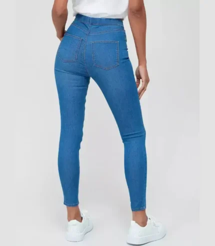 Woman-wearing-essential-stretch-jeggings—high-waist-skinny-denim